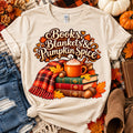 Books Blankets and Pumpkin Spice fall book lover design on a cream shirt